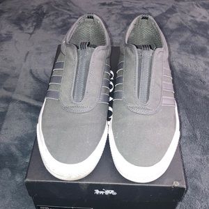 I am selling a pre-owned gray Adidas slip on sneakers